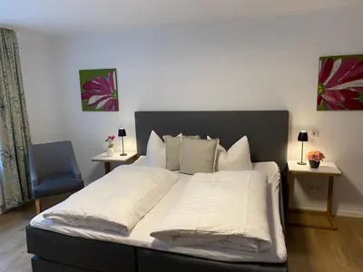 Ein Bett oder Betten in einem Zimmer der Unterkunft Hotel Ostermann