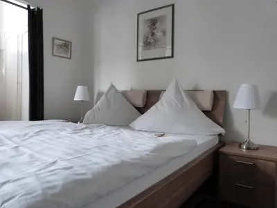 Ein Bett oder Betten in einem Zimmer der Unterkunft Hotel Jägerhof