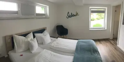 Ein Bett oder Betten in einem Zimmer der Unterkunft Siebente - Gästezimmer Gans im Grünen
