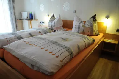 Ein Bett oder Betten in einem Zimmer der Unterkunft Gästehaus Petra