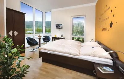 Ein Bett oder Betten in einem Zimmer der Unterkunft Hotel Pohl