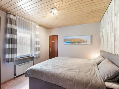 Ein Bett oder Betten in einem Zimmer der Unterkunft Feusdorf Forest Bungalow