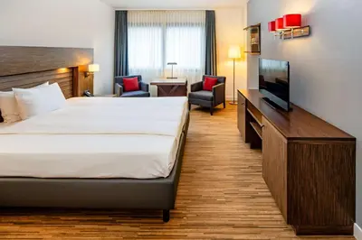 Ein Bett oder Betten in einem Zimmer der Unterkunft Park Plaza Trier