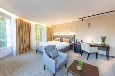 Ein Bett oder Betten in einem Zimmer der Unterkunft Parkhotel Kurhaus