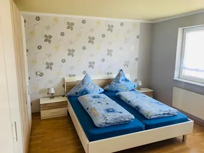 Ein Bett oder Betten in einem Zimmer der Unterkunft Ferienwohnung Hochwaldblick 3