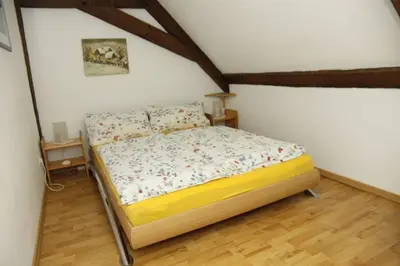 Ein Bett oder Betten in einem Zimmer der Unterkunft Schwalbennest auf dem Weingut Arthur Melsheimer