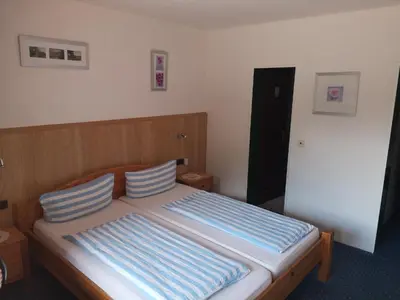 Ein Bett oder Betten in einem Zimmer der Unterkunft Hotel Finkenberg