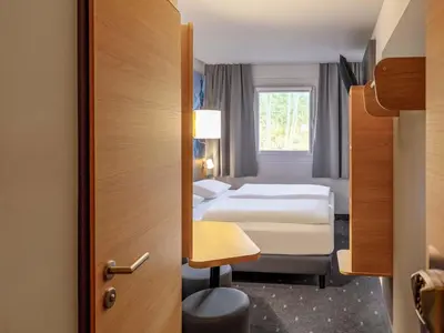Ein Bett oder Betten in einem Zimmer der Unterkunft B&B HOTEL Koblenz-Nord