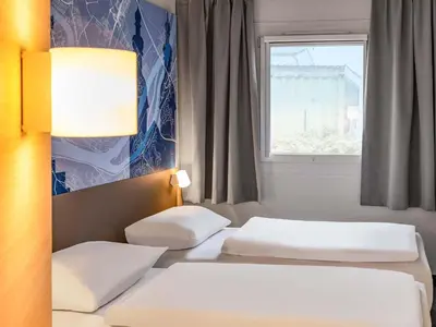 Ein Bett oder Betten in einem Zimmer der Unterkunft B&B HOTEL Koblenz-Nord