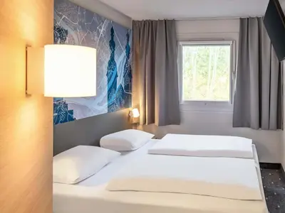 Ein Bett oder Betten in einem Zimmer der Unterkunft B&B HOTEL Koblenz-Nord
