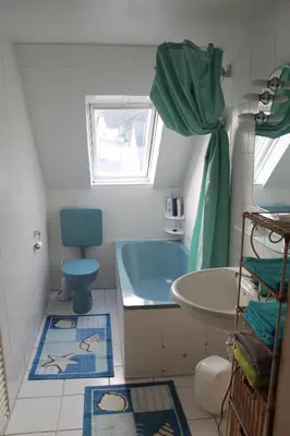 Ein Badezimmer in der Unterkunft Ferienwohnung im Galerie-Haus