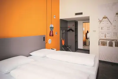 Ein Bett oder Betten in einem Zimmer der Unterkunft Vienna House Easy by Wyndham Trier