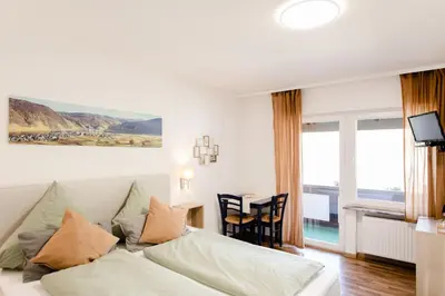 Ein Bett oder Betten in einem Zimmer der Unterkunft Ferien Weingut Schneider