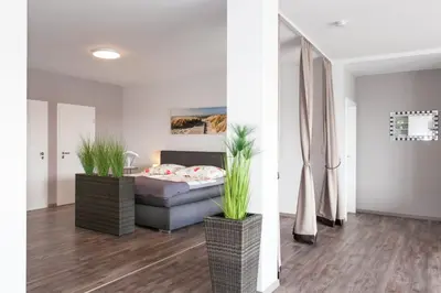 Ein Bett oder Betten in einem Zimmer der Unterkunft Kaiser - Ferienwohnungen Dreiburgenblick
