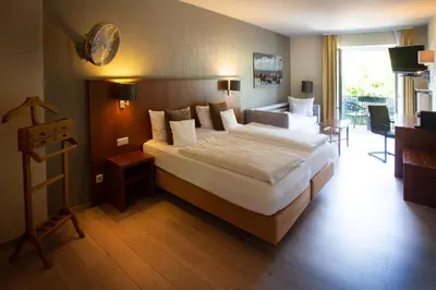 Ein Bett oder Betten in einem Zimmer der Unterkunft Bad Emser Hof