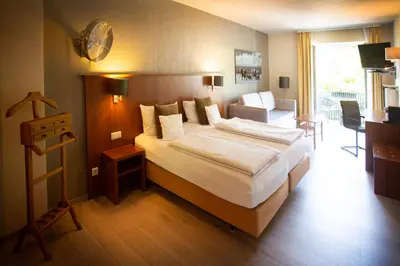 Ein Bett oder Betten in einem Zimmer der Unterkunft Bad Emser Hof