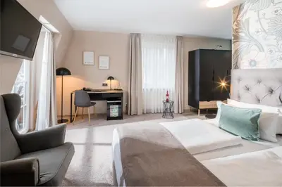 Ein Bett oder Betten in einem Zimmer der Unterkunft Hotel Germania