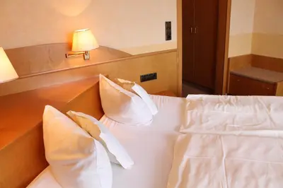 Ein Bett oder Betten in einem Zimmer der Unterkunft Weinhotel Sonnenschein