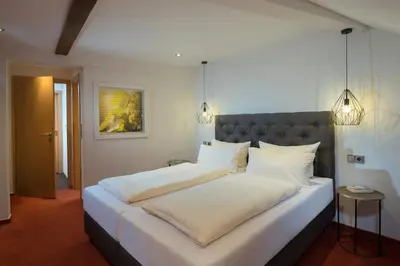 Ein Bett oder Betten in einem Zimmer der Unterkunft Hotel Weinhof