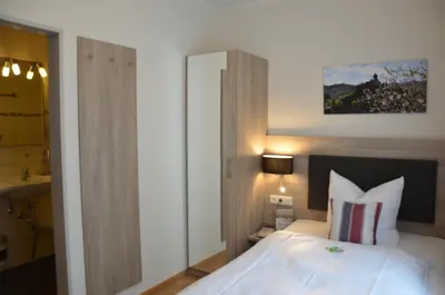 Ein Bett oder Betten in einem Zimmer der Unterkunft Flair Hotel am Rosenhügel - Garni