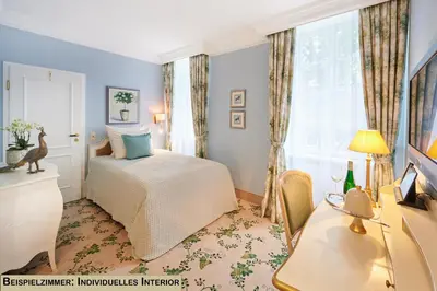 Ein Bett oder Betten in einem Zimmer der Unterkunft Weinromantikhotel Richtershof