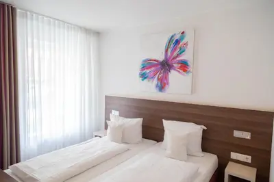 Ein Bett oder Betten in einem Zimmer der Unterkunft Das Ebertor - Hotel & Hostel
