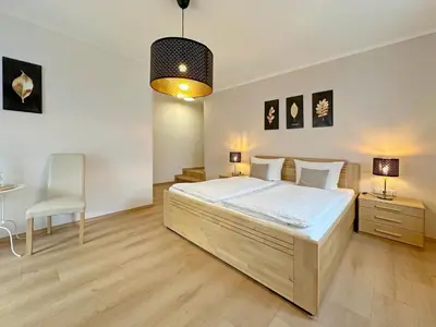 Ein Bett oder Betten in einem Zimmer der Unterkunft Gast und Weinhof Beim Schneemann