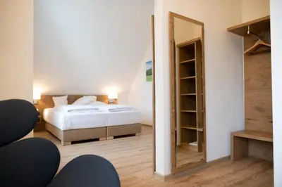 Ein Bett oder Betten in einem Zimmer der Unterkunft Landhotel Kauzenberg