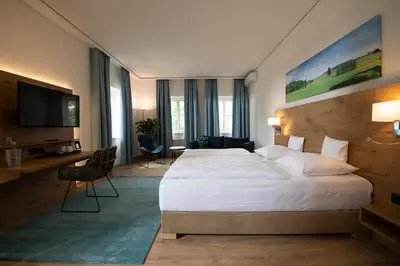 Ein Bett oder Betten in einem Zimmer der Unterkunft Landhotel Kauzenberg