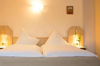 Ein Bett oder Betten in einem Zimmer der Unterkunft Hotel Restaurant Zur Neroburg