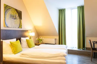 Ein Bett oder Betten in einem Zimmer der Unterkunft Hotel Aulmann