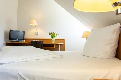 Ein Bett oder Betten in einem Zimmer der Unterkunft Hotel Aulmann