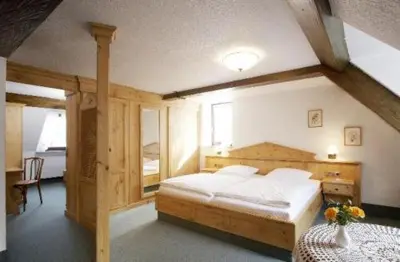 Ein Bett oder Betten in einem Zimmer der Unterkunft Hotel Alter Posthof