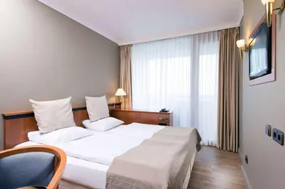 Ein Bett oder Betten in einem Zimmer der Unterkunft Wyndham Garden Lahnstein Koblenz