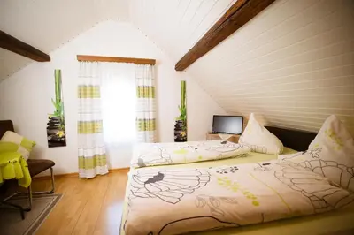 Ein Bett oder Betten in einem Zimmer der Unterkunft Pension Haus Andreas
