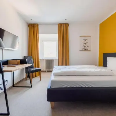 Ein Bett oder Betten in einem Zimmer der Unterkunft Hotel Trabener Hof
