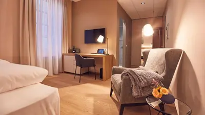 Ein Bett oder Betten in einem Zimmer der Unterkunft Seehotel Maria Laach