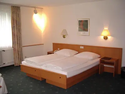 Ein Bett oder Betten in einem Zimmer der Unterkunft Hotel Bitburg