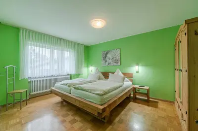 Ein Bett oder Betten in einem Zimmer der Unterkunft Ferienhaus Störzel Wohnung A