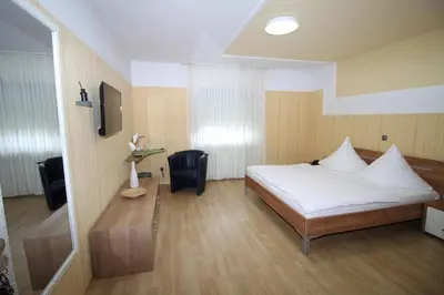 Ein Bett oder Betten in einem Zimmer der Unterkunft Hotel Geromont