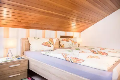 Ein Bett oder Betten in einem Zimmer der Unterkunft Hotel Burgblick