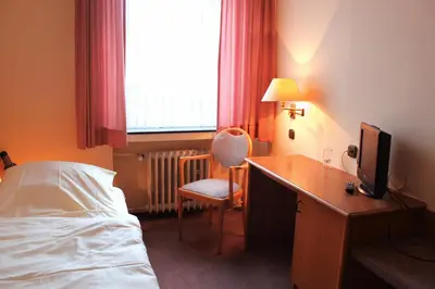Ein Bett oder Betten in einem Zimmer der Unterkunft Hotel Niederée