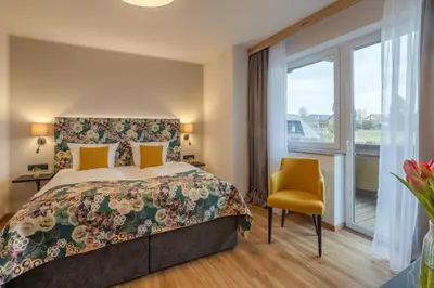 Ein Bett oder Betten in einem Zimmer der Unterkunft Natur- und Wohlfühlhotel Kastenholz