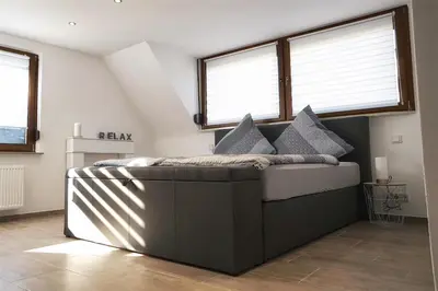 Ein Bett oder Betten in einem Zimmer der Unterkunft Ferienwohnung Traumblick