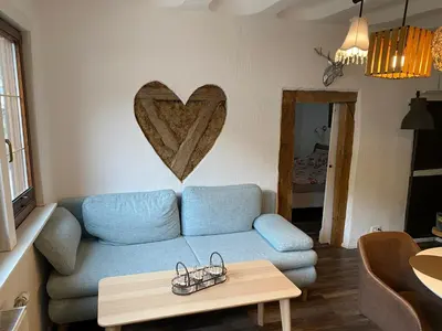 Ein Sitzbereich in der Unterkunft Schöne Ferienwohnung Burgruine Fachwerkhaus