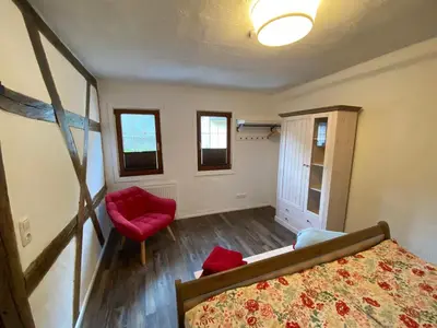 Ein Bett oder Betten in einem Zimmer der Unterkunft Schöne Ferienwohnung Burgruine Fachwerkhaus