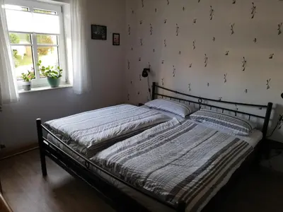 Ein Bett oder Betten in einem Zimmer der Unterkunft Ferienwohnung Eifelgold Esch