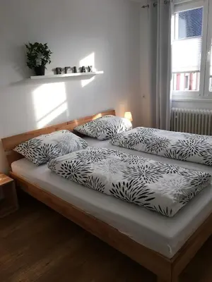 Ein Bett oder Betten in einem Zimmer der Unterkunft Ferienwohnungen Stadtgeflüster