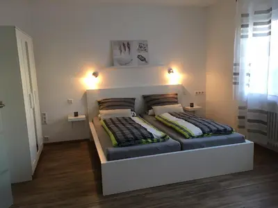 Ein Bett oder Betten in einem Zimmer der Unterkunft Ferienwohnungen Stadtgeflüster