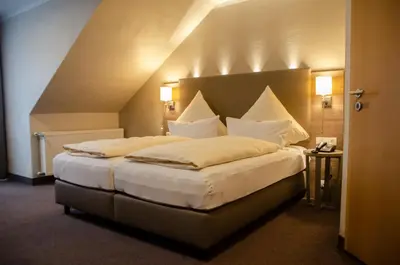 Ein Bett oder Betten in einem Zimmer der Unterkunft Hotel Morjan